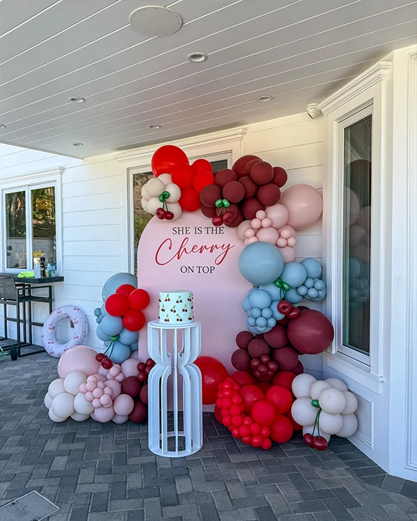 Cherry themed birthday balloon backdrop at private home in Burbank