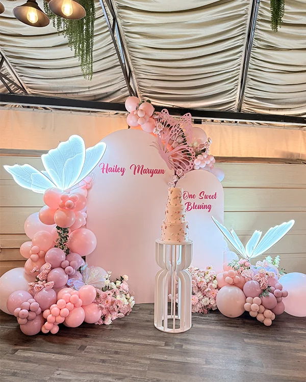 Hailey Maryam's 1st birthday pink butterfly balloon arch at Verdi Garden Encino